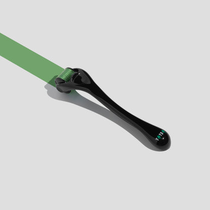 Black derma roller leaving a green smear on white background