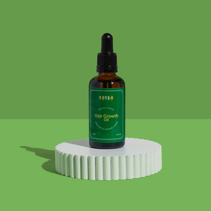 Amber bottle in green studio background