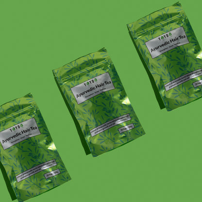 Three green hair tea bags on green studio background