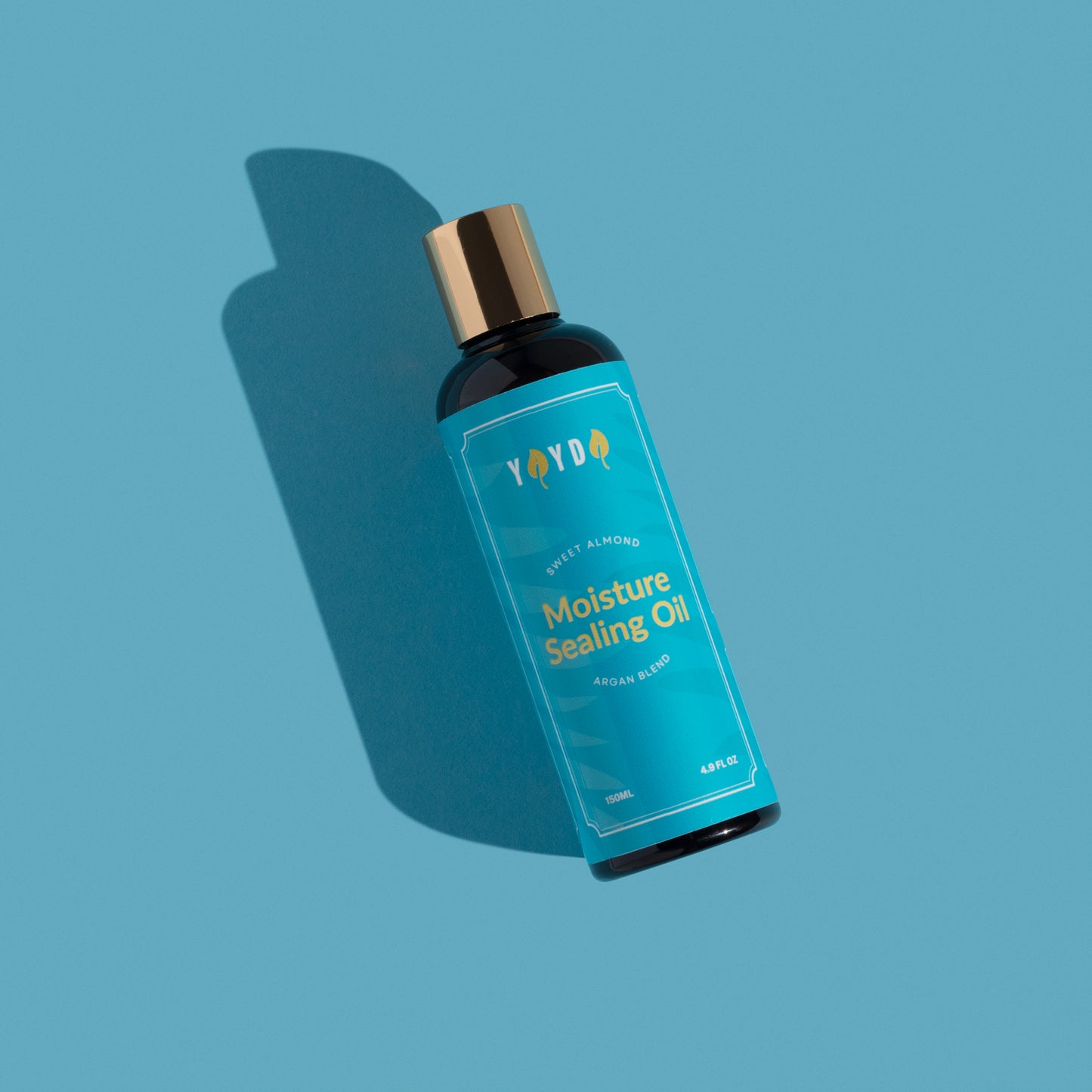 Sealing oil with blue label on blue studio background